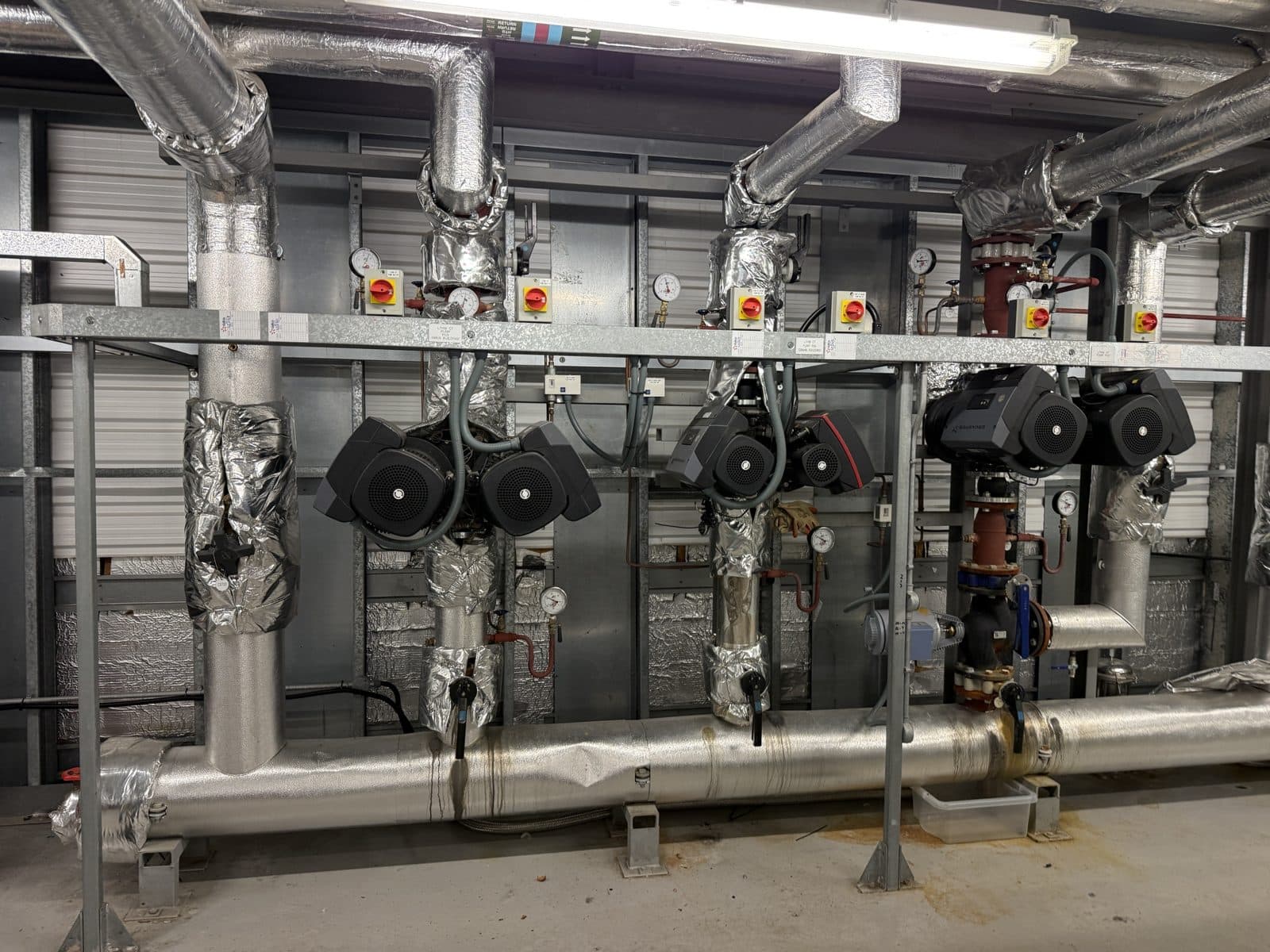 Plant room heating pumps and pipework under planned maintenance