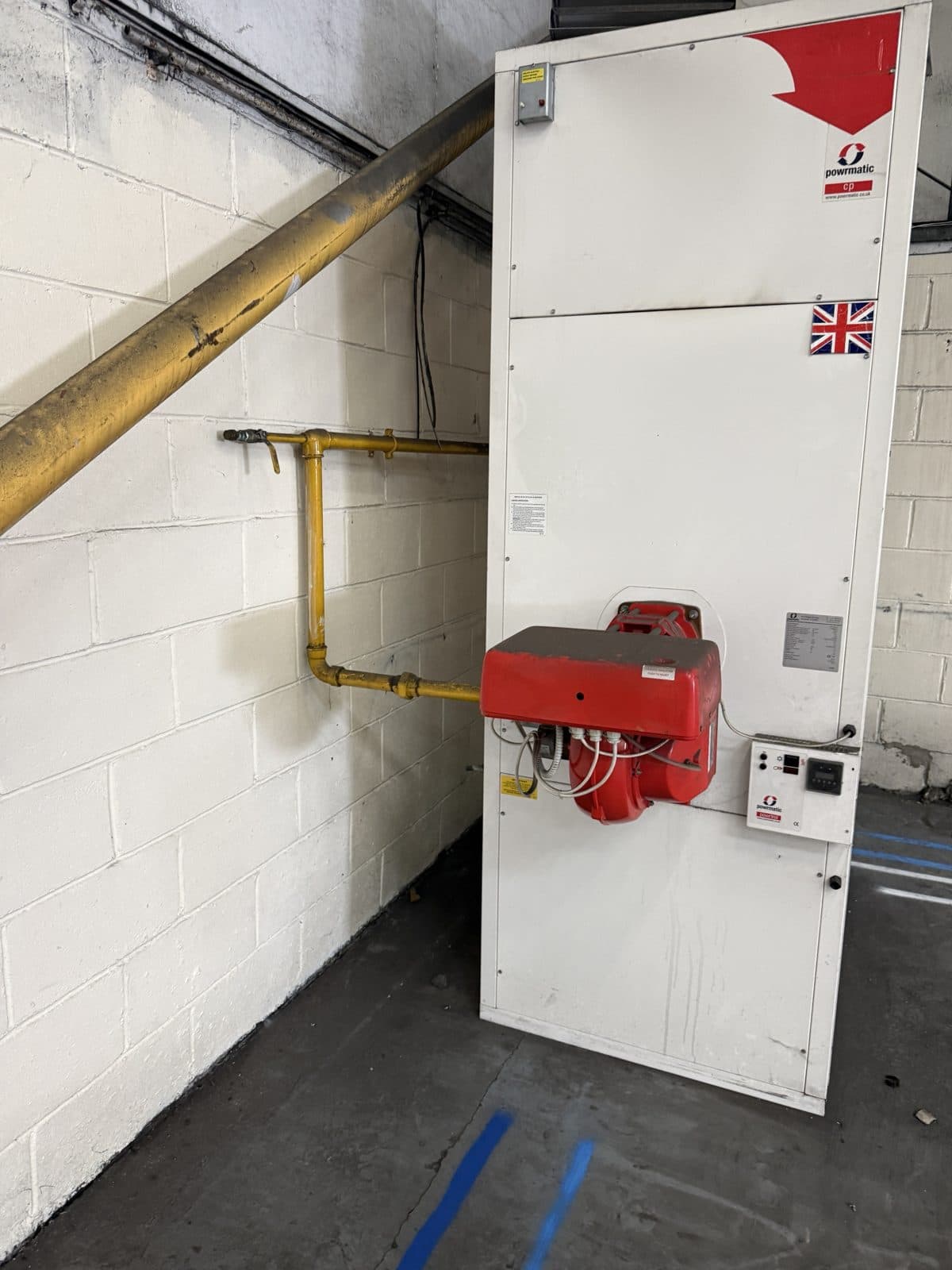 Gas-fired warm air heater and gas pipework in a warehouse, Lanarkshire